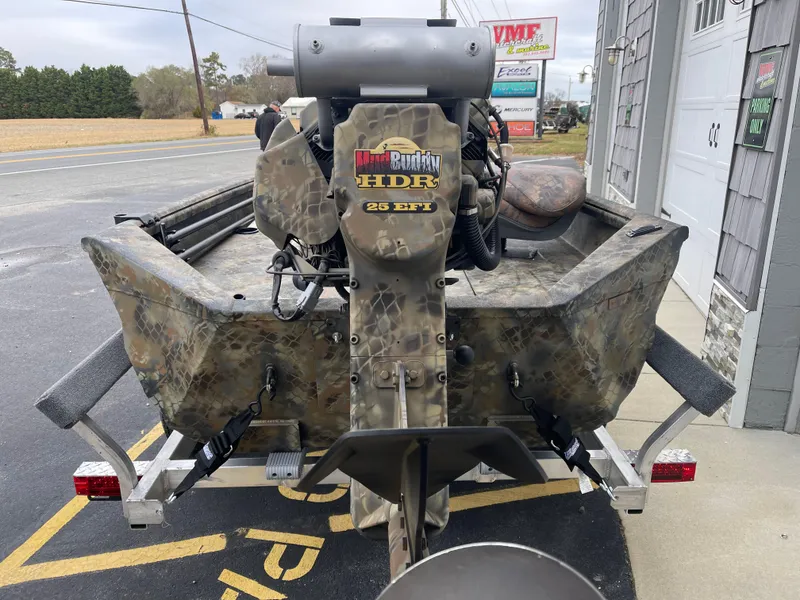 Slide: The Image of 2025 Excel Eclipse boat with camouflage design and HDR 25 EFI motor. - 16