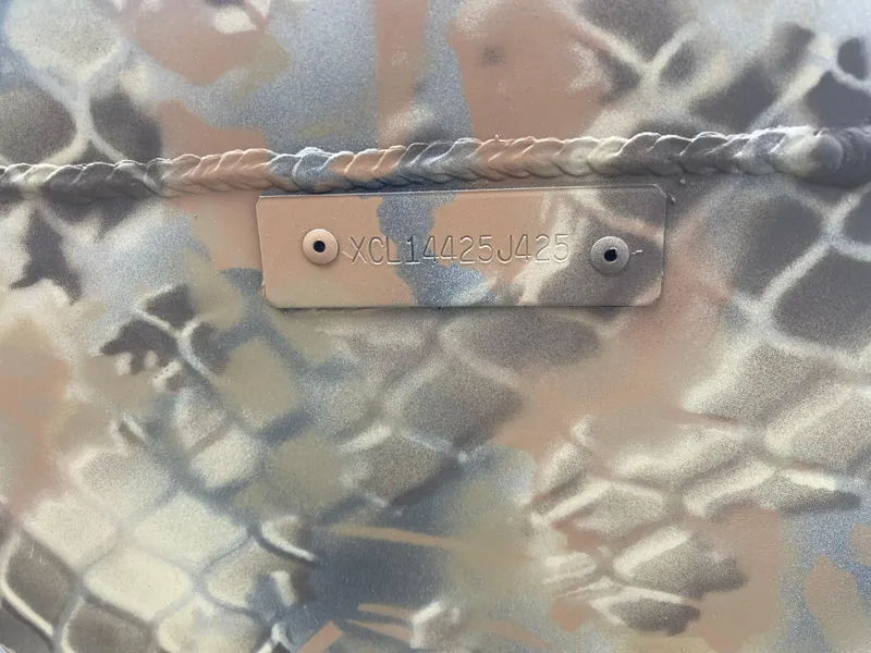 Slide: The Image of Camouflage-patterned Excel Eclipse 2025 with visible serial number plate. - 17