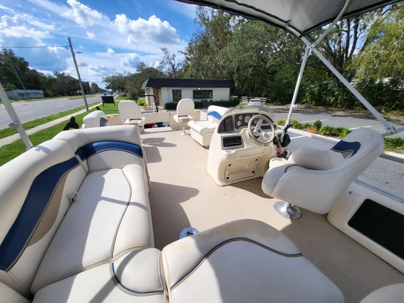 Slide: The Image of 2006 Godfrey Sweetwater 2586DF pontoon boat with spacious seating and steering console. - 10