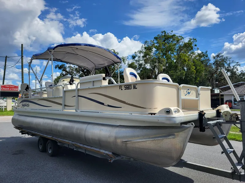 Slide: The Image of 2006 Godfrey Sweetwater 2586DF pontoon boat on trailer under blue sky. - 2