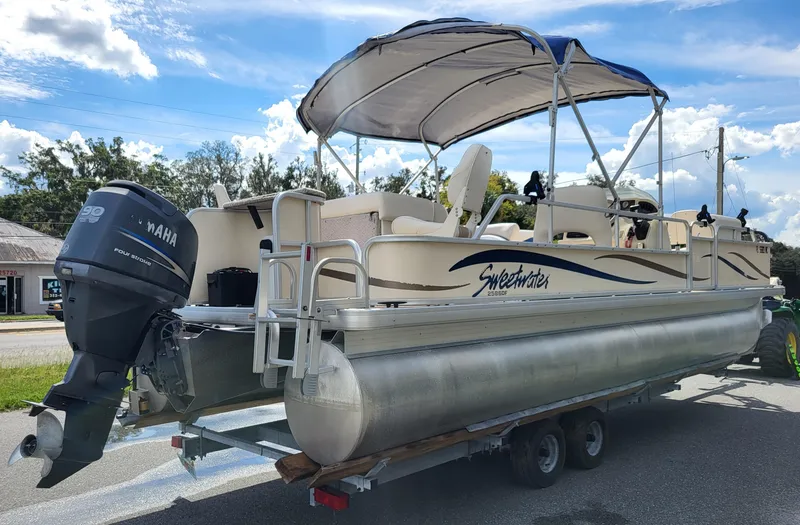 Slide: The Image of 2006 Godfrey Sweetwater 2586DF pontoon boat with Yamaha outboard motor on trailer. - 3