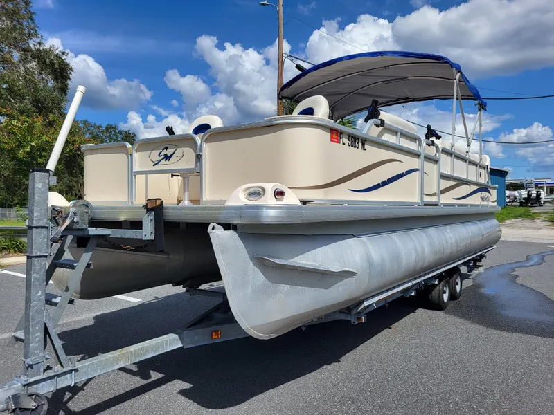 Slide: The Image of 2006 Godfrey Sweetwater 2586DF pontoon boat on trailer under blue sky. - 5