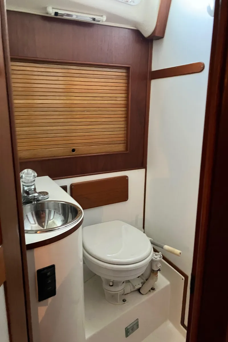 Slide: The Image of 1983 Morgan Nelson Marek 454 yacht bathroom with sink and toilet. - 10