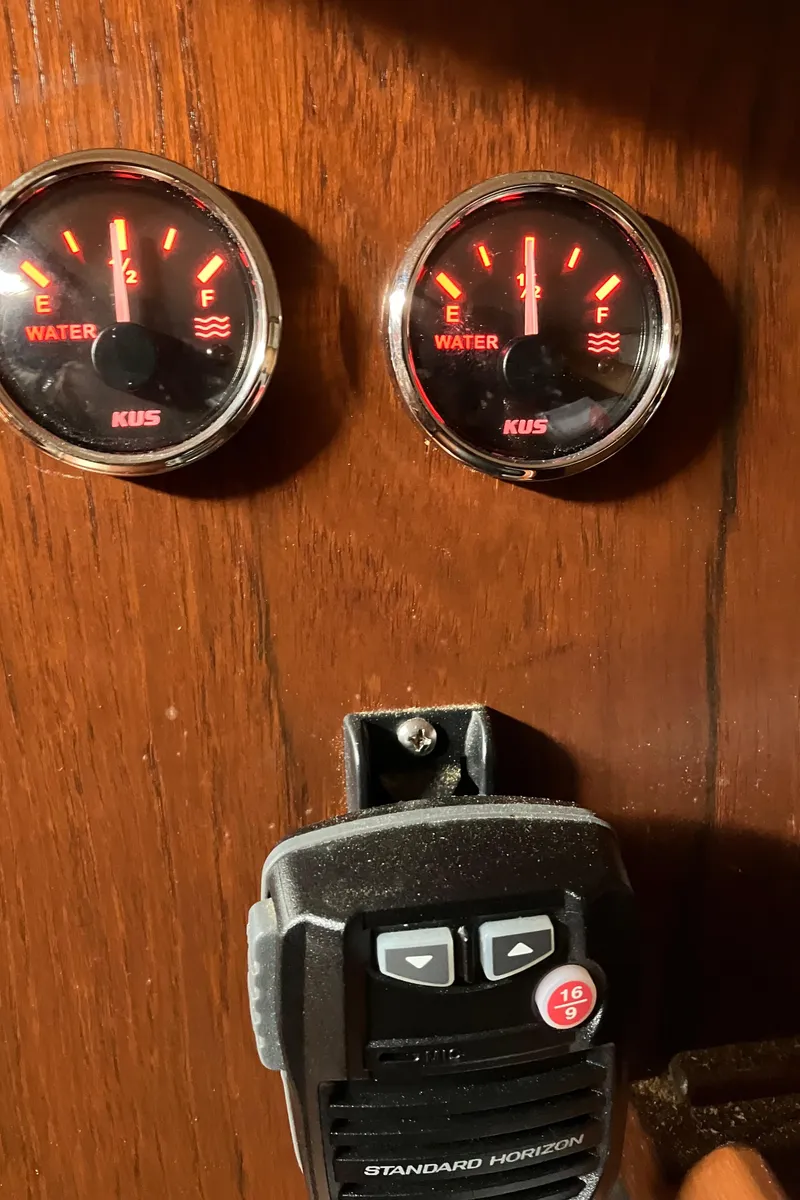 Slide: The Image of 1983 Morgan Nelson Marek 454 boat dashboard with water gauges and radio. - 15