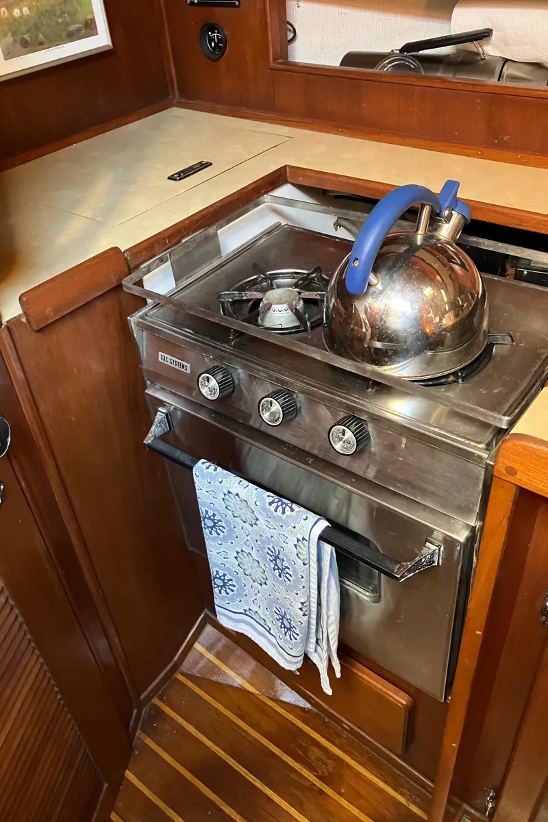 Slide: The Image of 1983 Morgan NELSON MAREK 454 yacht kitchen with stove and kettle. - 16