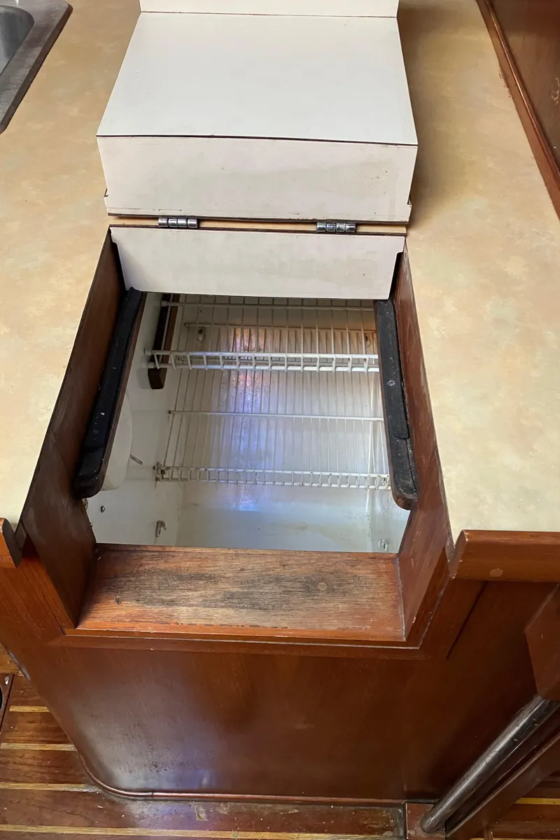 Slide: The Image of 1983 Morgan NELSON MAREK 454 yacht interior with built-in refrigerator. - 18