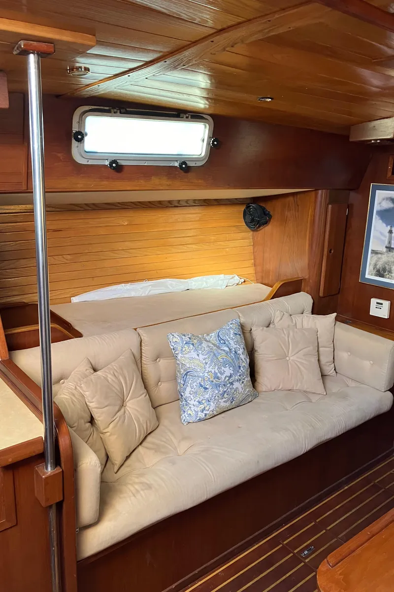 Slide: The Image of Interior of 1983 Morgan Nelson Marek 454 yacht with cozy seating and wooden finish. - 19