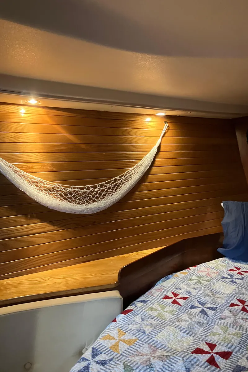 Slide: The Image of Cozy cabin interior of 1983 Morgan Nelson Marek 454 sailboat with quilted bedding. - 8