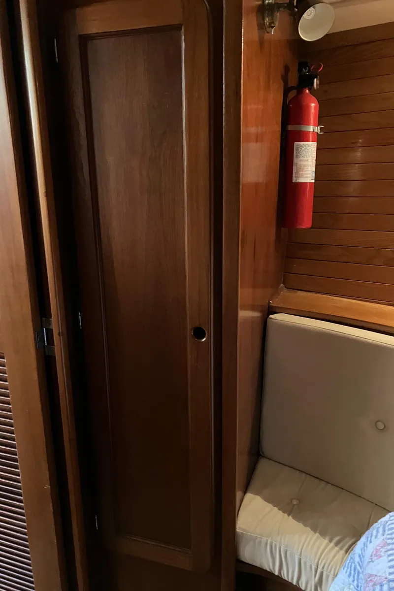 Slide: The Image of 1983 Morgan Nelson Marek 454 interior with wooden paneling and fire extinguisher. - 9
