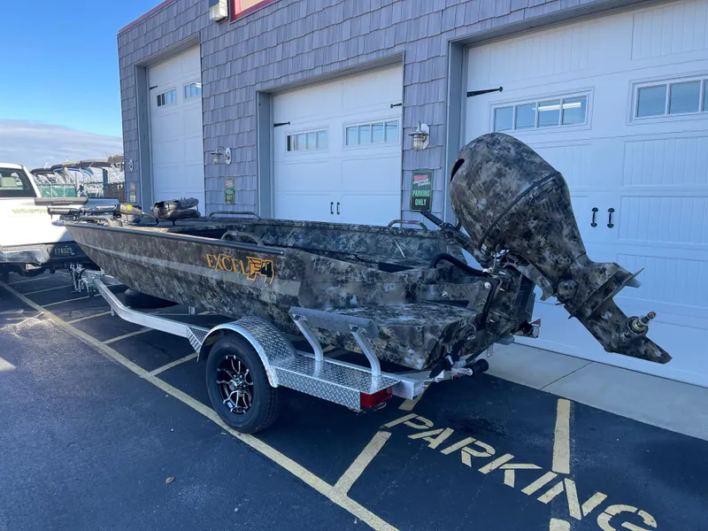 Slide: The Image of 2025 Excel 1860 F4 Shallow Water boat with camouflage design on trailer. - 3