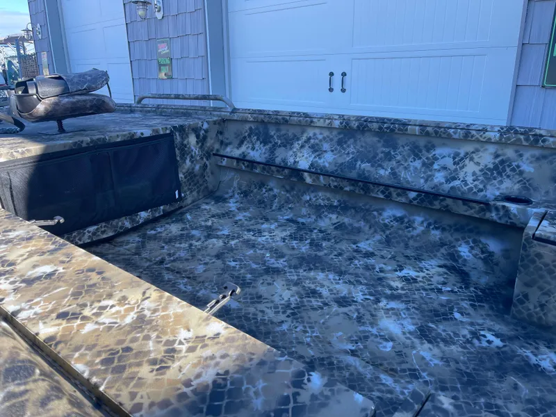 Slide: The Image of 2025 Excel 1860 F4 Shallow Water boat with camouflage interior design. - 9