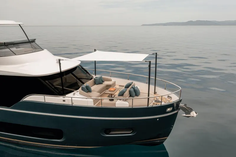Slide: The Image of Azimut Magellano 60 yacht, 2025 model, featuring luxurious deck seating and ocean backdrop. - 17