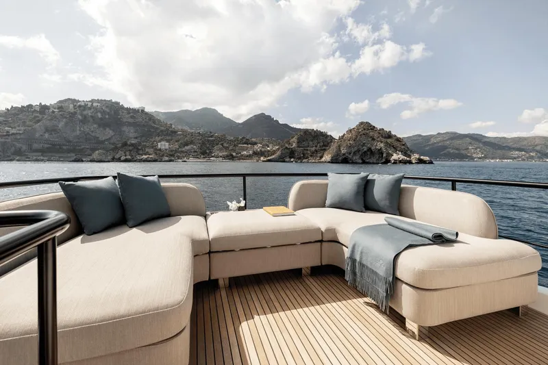Slide: The Image of Luxurious Azimut Magellano 60 yacht deck with elegant seating, ocean view, 2025 model. - 13