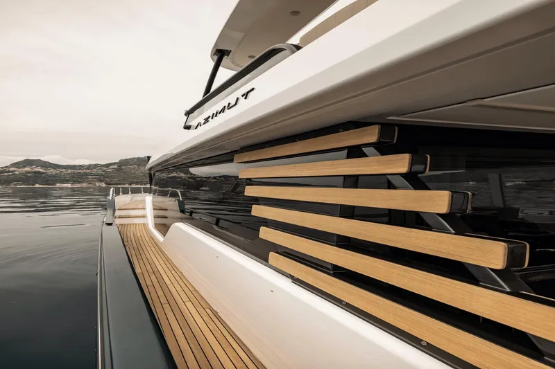Slide: The Image of Azimut Magellano 60 yacht, 2025 model, featuring sleek wooden deck design. - 36