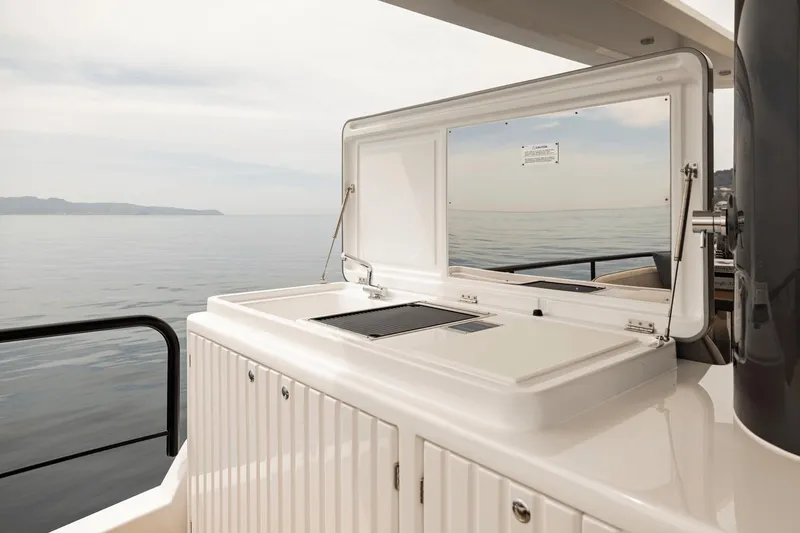 Slide: The Image of Outdoor kitchen on 2025 Azimut Magellano 60 yacht with ocean view. - 31