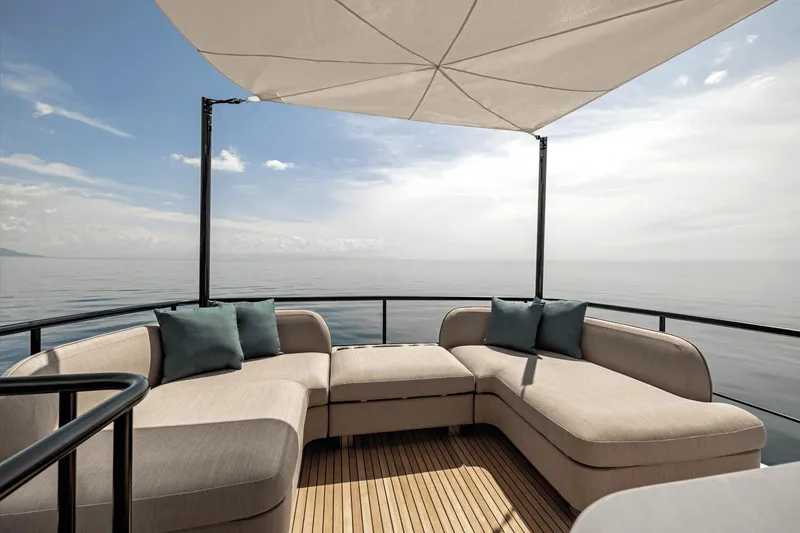 Slide: The Image of Luxurious outdoor seating on 2025 Azimut Magellano 60 yacht with ocean view. - 14