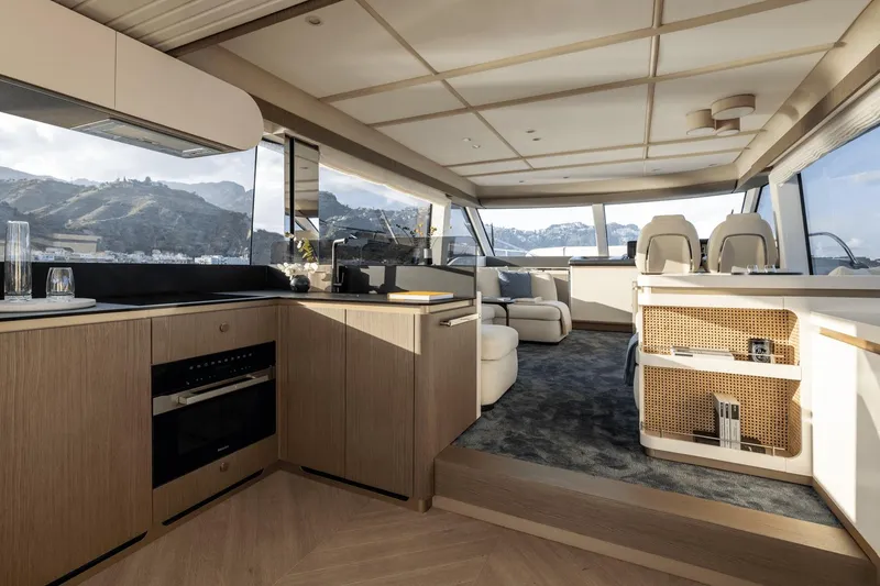 Slide: The Image of Luxurious interior of 2025 Azimut Magellano 60 yacht with modern kitchen and seating area. - 41