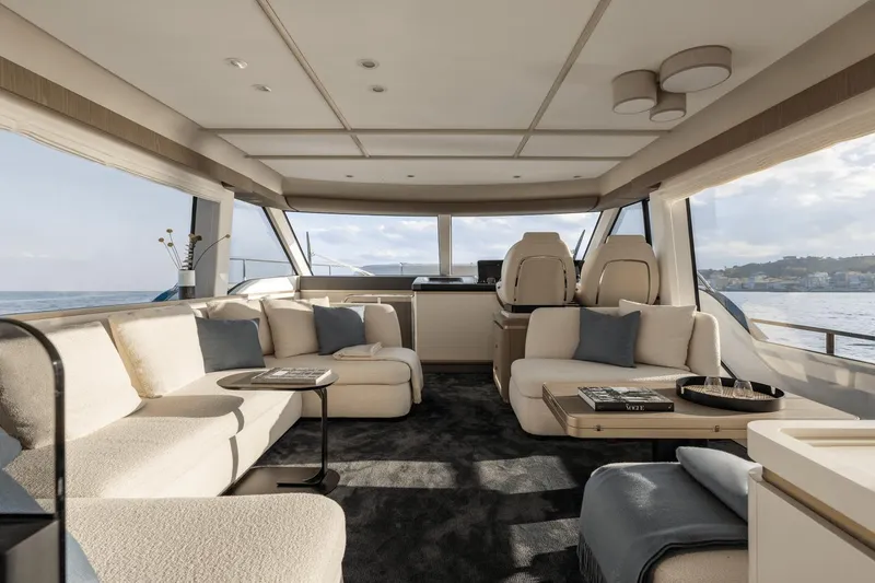 Slide: The Image of Luxurious interior of 2025 Azimut Magellano 60 yacht with elegant seating and panoramic windows. - 37