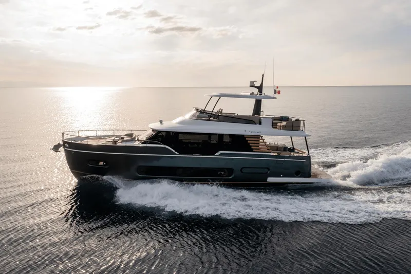 Slide: The Image of 2025 Azimut Magellano 60 yacht cruising on open water at sunset. - 19