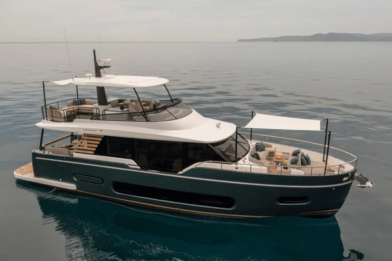 Slide: The Image of 2025 Azimut Magellano 60 yacht on calm sea, showcasing luxury design and spacious deck. - 16