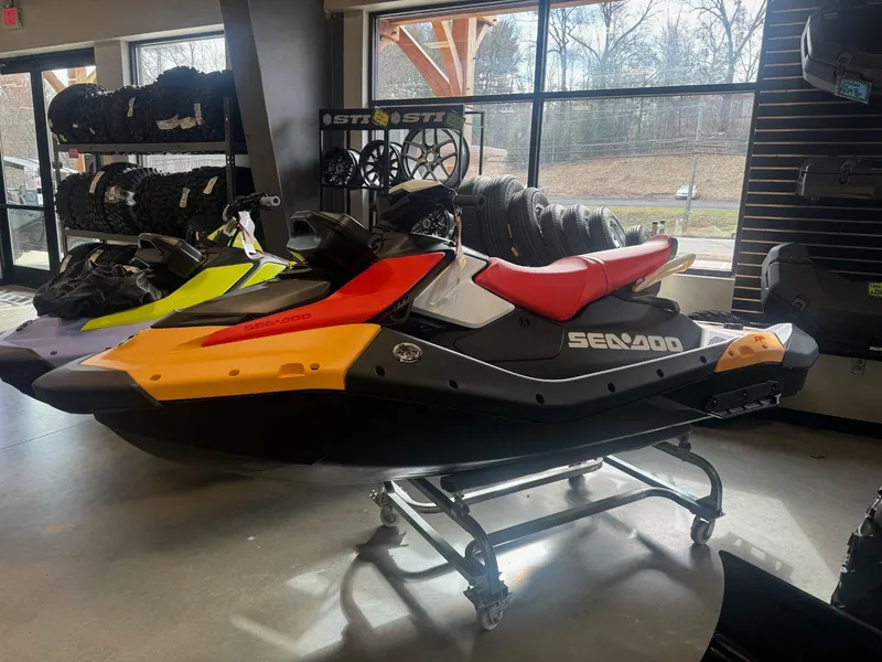 Slide: The Image of 2024 Sea-Doo Spark 3up with iBR Convenience Package and Sound System in showroom. - 3
