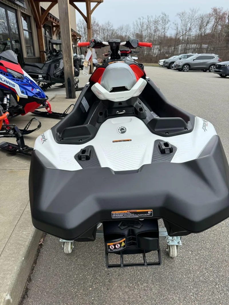 Slide: The Image of 2024 Sea-Doo SPARK TRIXX 3UP IBR jet ski parked outdoors. - 3