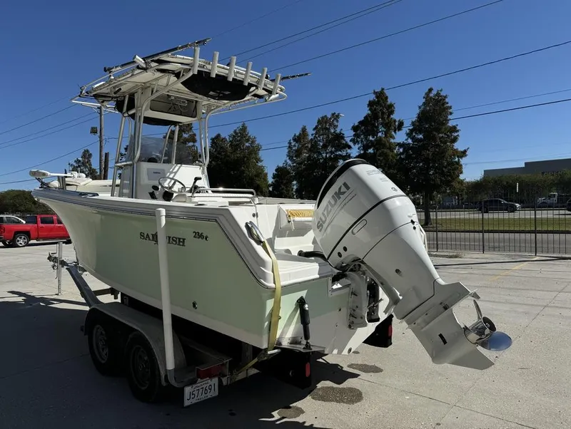 Slide: The Image of 2005 Sailfish 236 CC boat on trailer with Suzuki outboard motor. - 13