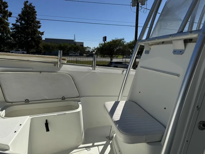 Slide: The Image of 2005 Sailfish 236 CC boat interior with seating and storage compartment. - 3