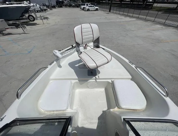 Slide: The Image of 2002 Bay Stealth 1880 BSVW boat with a central swivel seat on deck. - 14