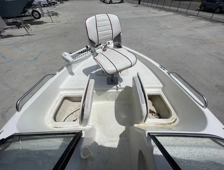 Slide: The Image of 2002 Bay Stealth 1880 BSVW boat with swivel seat and storage compartments. - 15