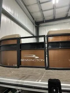 Slide: The Image of 2020 Bennington 23SPDXP pontoon boat in a storage facility. - 5