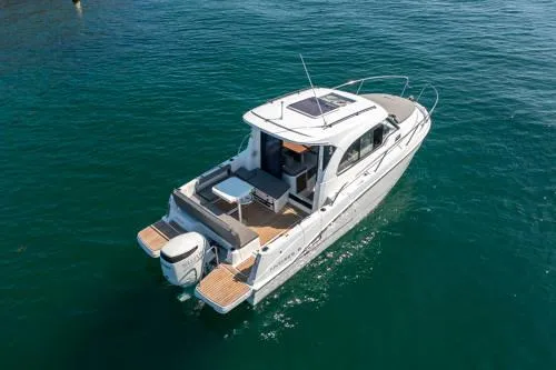 Slide: The Image of 2024 Beneteau Antares 8 V2 boat cruising on clear blue water. - 3