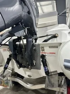 Slide: The Image of 2020 AB Inflatables 12dlx boat engine and hydraulic system in a garage setting. - 10