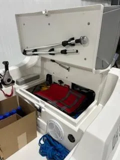 Slide: The Image of 2020 AB Inflatables 12dlx boat storage compartment with safety equipment and accessories. - 7