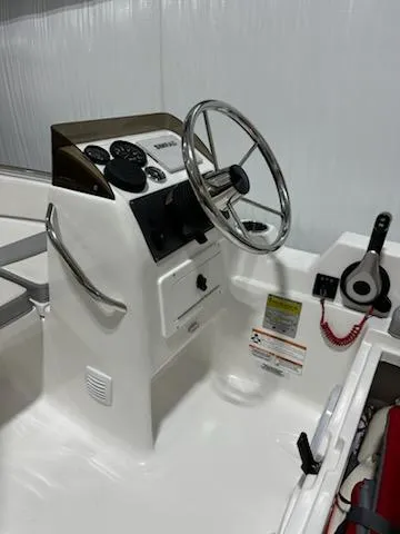 Slide: The Image of 2020 AB Inflatables 12dlx boat console with steering wheel and controls. - 9