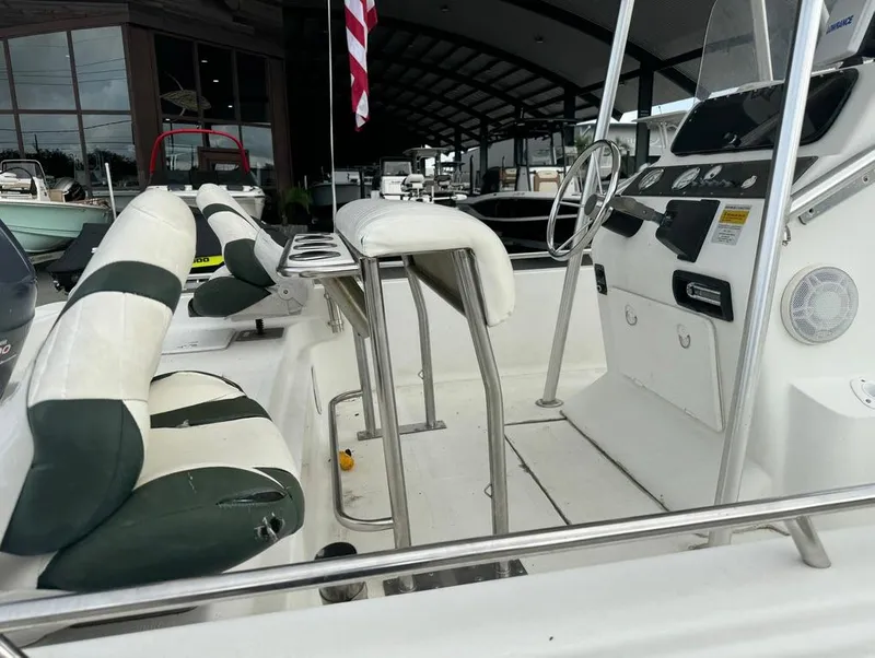 Slide: The Image of 2001 Bay Stealth 2230 boat interior with seating and steering console. - 10