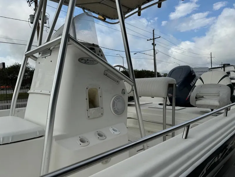 Slide: The Image of 2001 Bay Stealth 2230 boat with Yamaha outboard motor, under cloudy sky. - 15