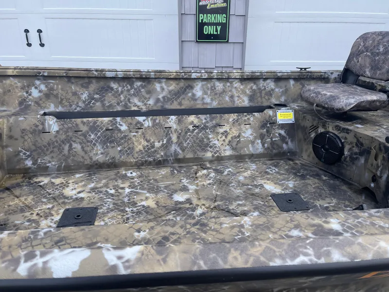 Slide: The Image of 2025 Excel 1751 River Warrior boat interior with camouflage design and seating. - 10