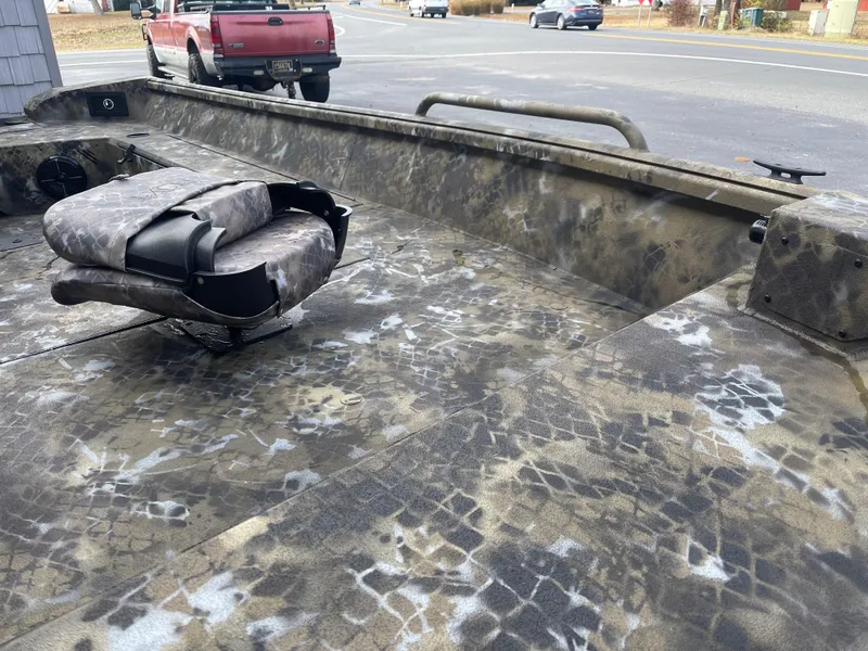 Slide: The Image of 2025 Excel 1751 River Warrior boat with camouflage interior design. - 6