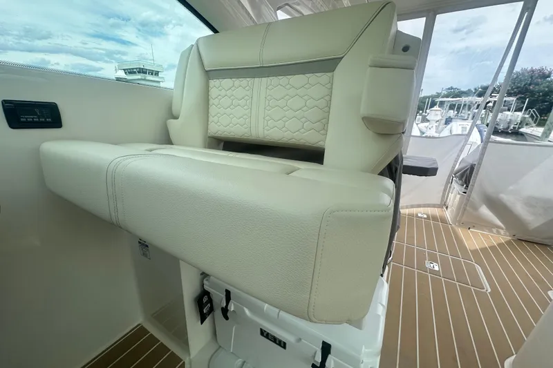Slide: The Image of 2026 Tiara Yachts 34 LX interior with luxurious beige seating and modern design. - 13