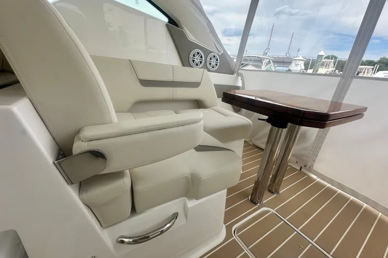 Slide: The Image of Luxurious interior of 2026 Tiara Yachts 34 LX with plush seating and elegant table. - 15