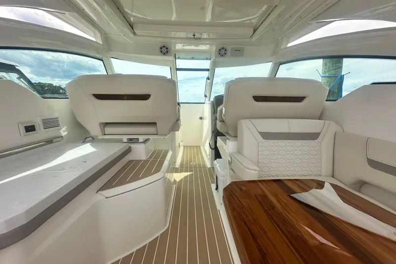 Slide: The Image of Interior of 2026 Tiara Yachts 34 LX, featuring luxurious seating and sleek design. - 18