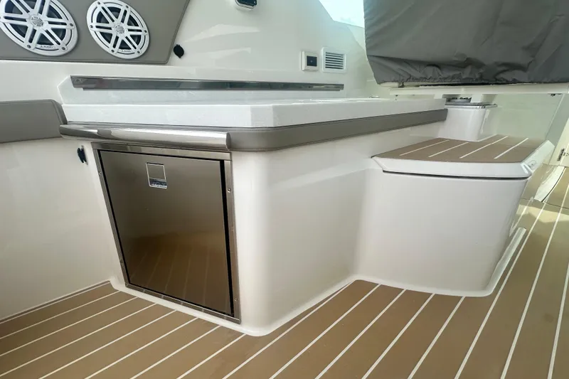 Slide: The Image of 2026 Tiara Yachts 34 LX interior with sleek cabinetry and modern design elements. - 5