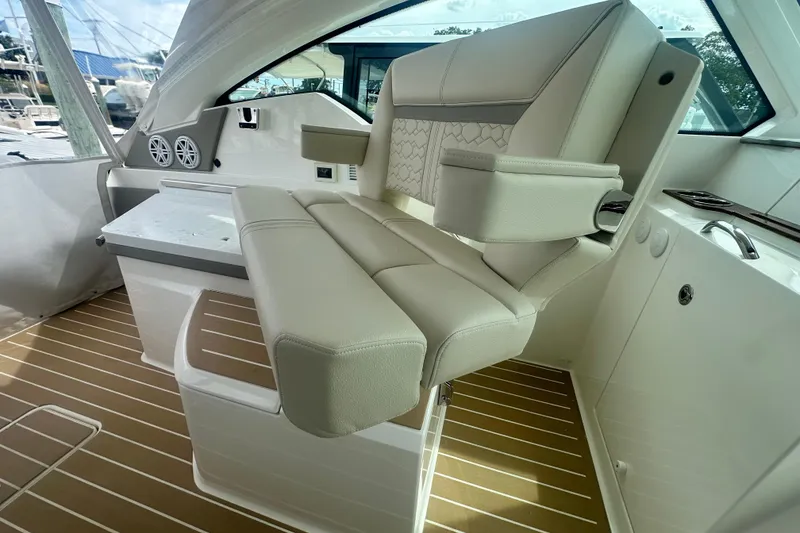 Slide: The Image of 2026 Tiara Yachts 34 LX interior with luxurious seating and modern design. - 7