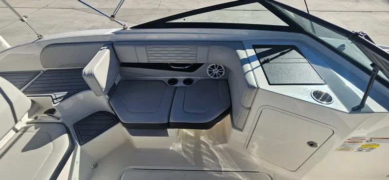 Slide: The Image of Interior view of 2021 Sea Ray SPX 190 OB boat, featuring seating and dashboard. - 10