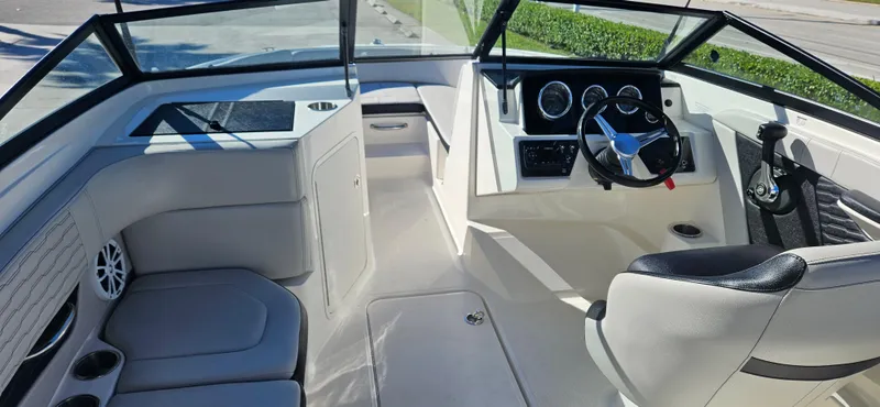 Slide: The Image of 2021 Sea Ray SPX 190 OB boat interior with modern dashboard and seating. - 5