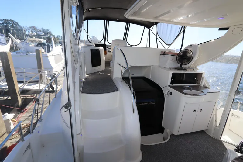 Slide: The Image of 2005 Meridian 459 Motoryacht interior with helm, seating, and kitchenette. - 14