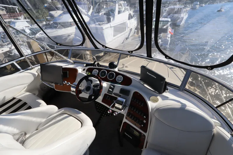 Slide: The Image of Interior view of 2005 Meridian 459 Motoryacht helm with navigation equipment. - 19