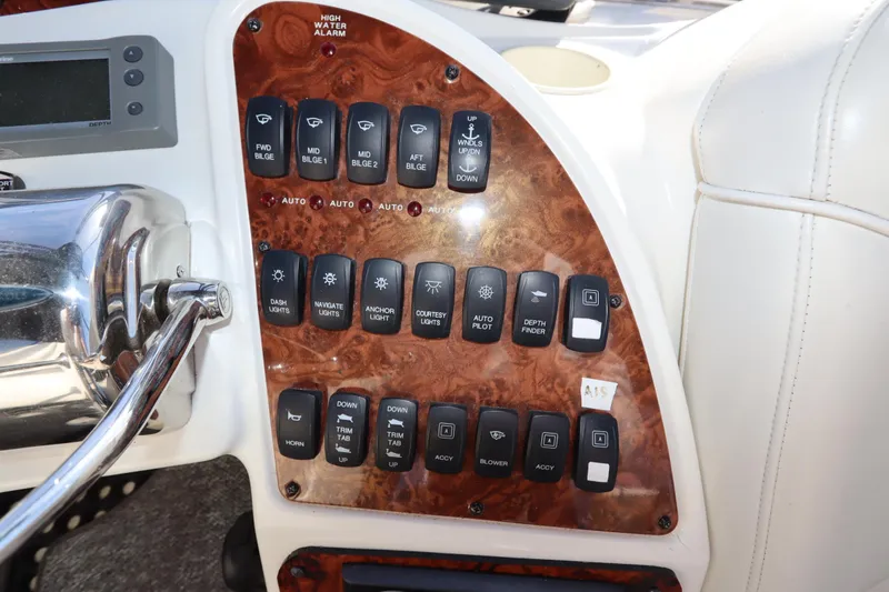 Slide: The Image of Control panel of a 2005 Meridian 459 Motoryacht with various switches and buttons. - 20