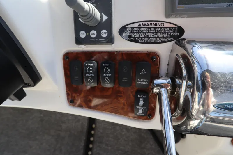 Slide: The Image of Control panel of a 2005 Meridian 459 Motoryacht with engine start buttons and warning label. - 25